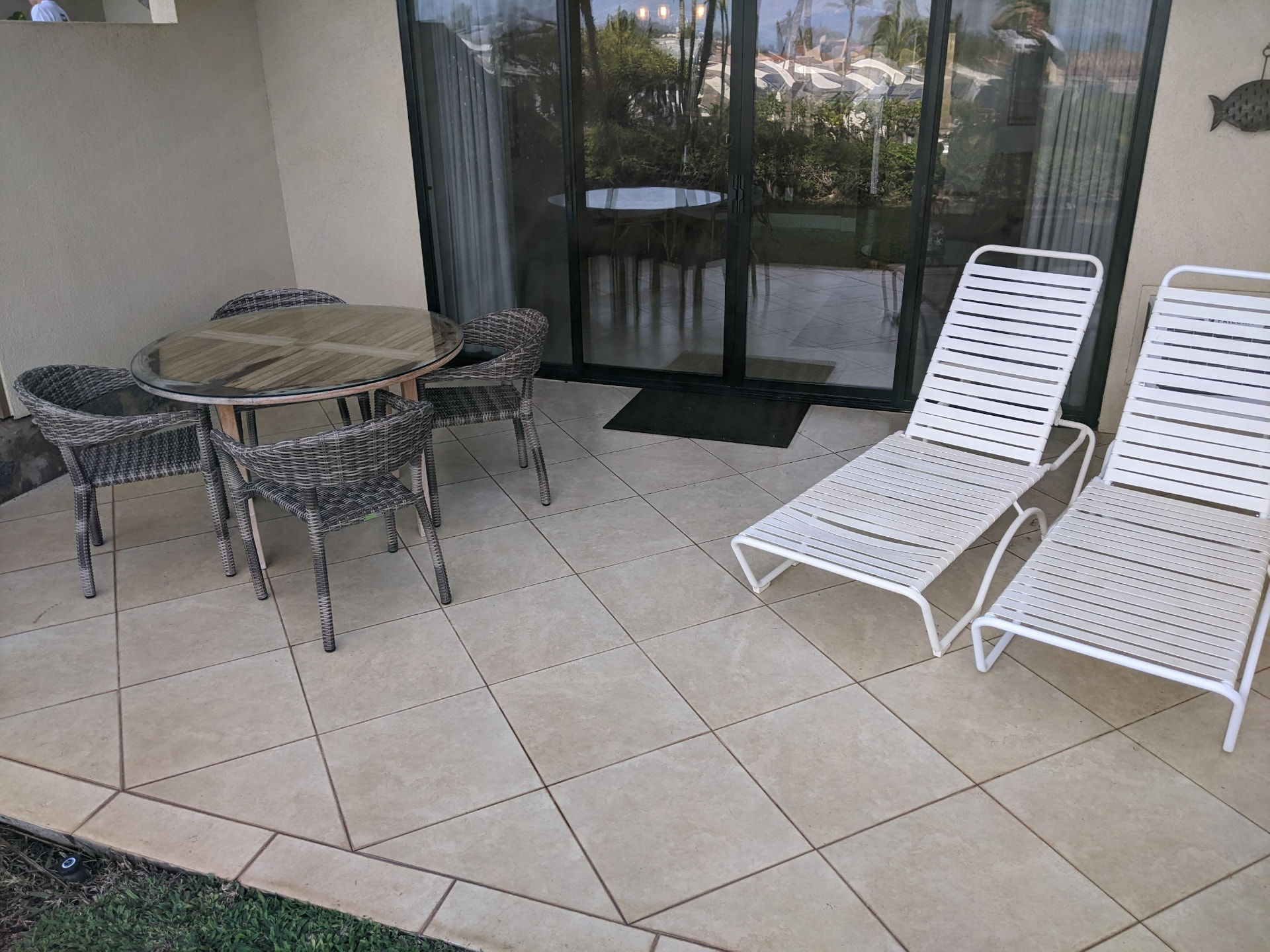 Spacious covered lanai with seating and loungers