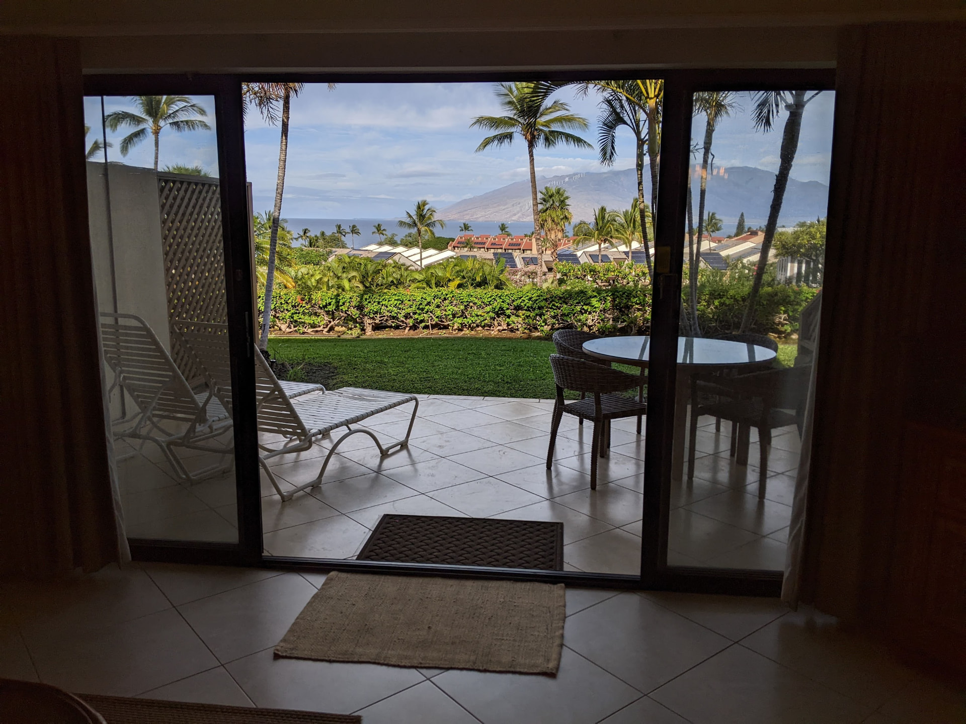 Ocean and mountain view framed by the living room doors