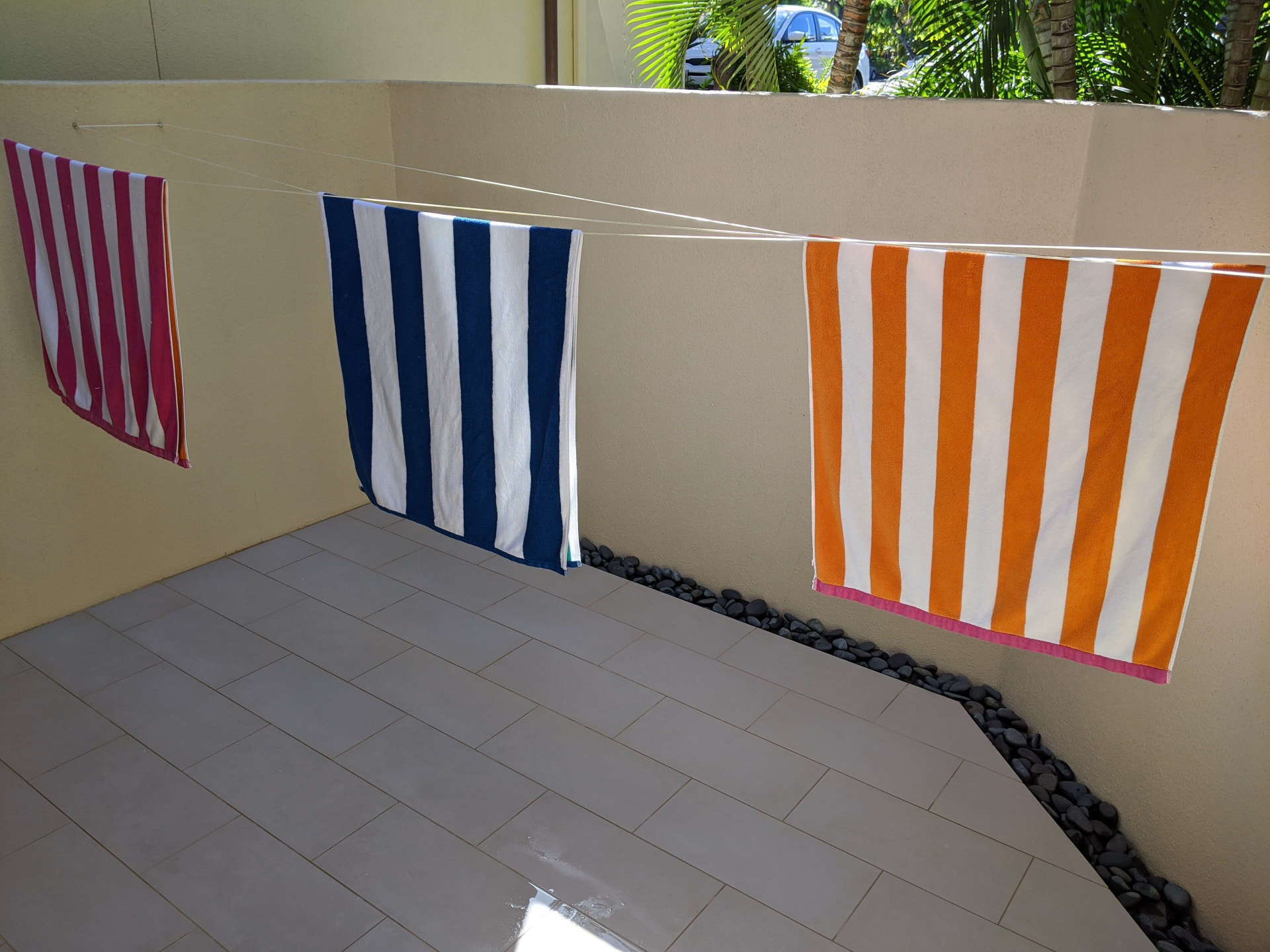 Private tiled patio with a retractable clothesline
