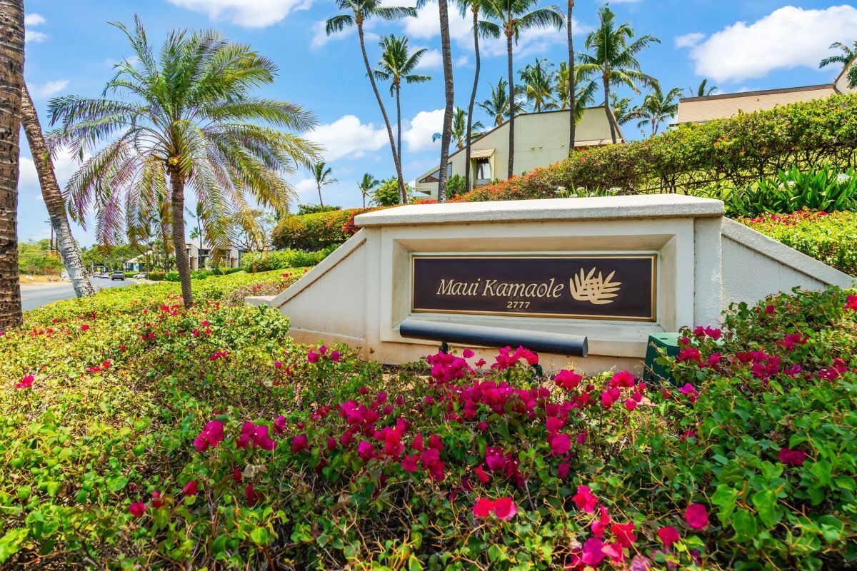 Maui Kamaole entrance sign surrounded by bougainvillea
