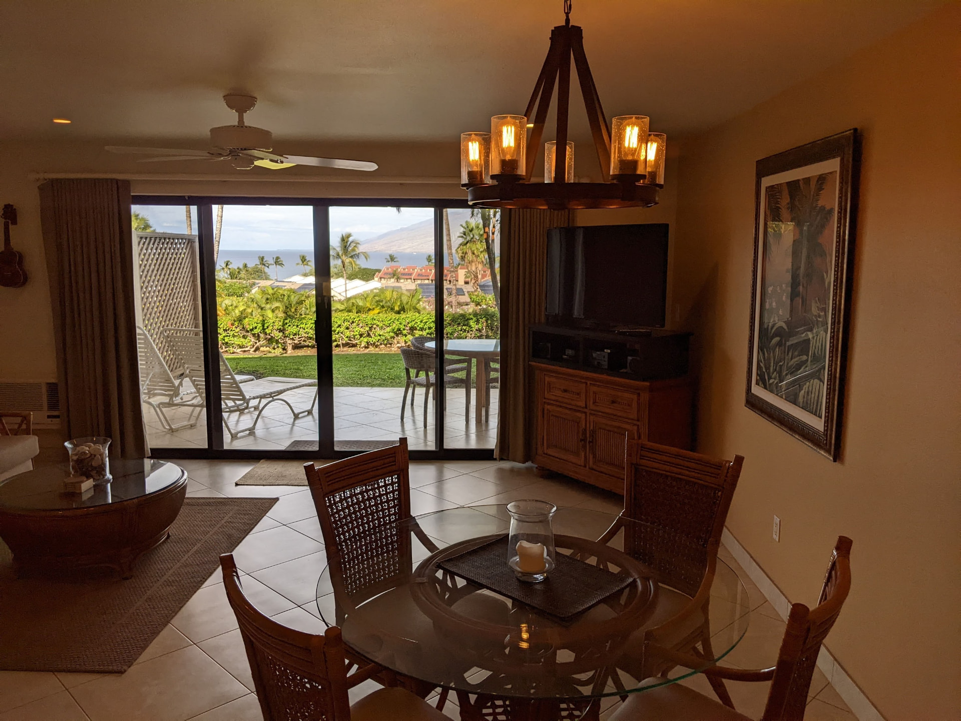 Open dining and living area with ocean view beyond the sliding doors